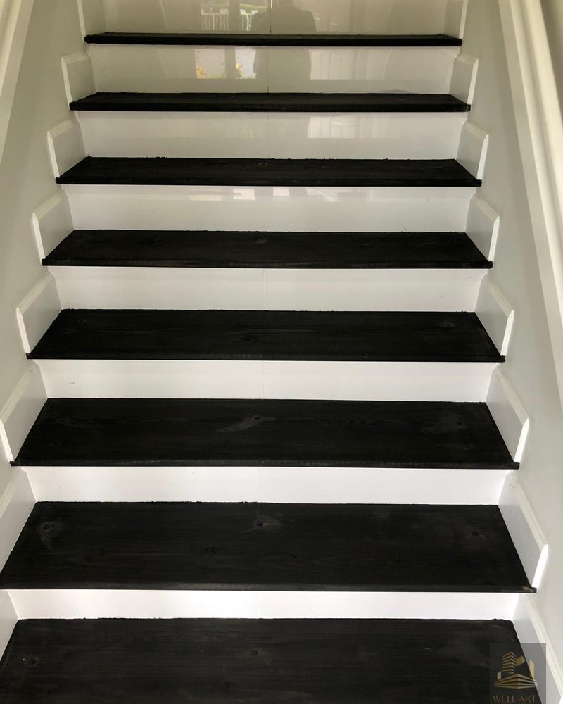 Finished — black and white staircase, same angle